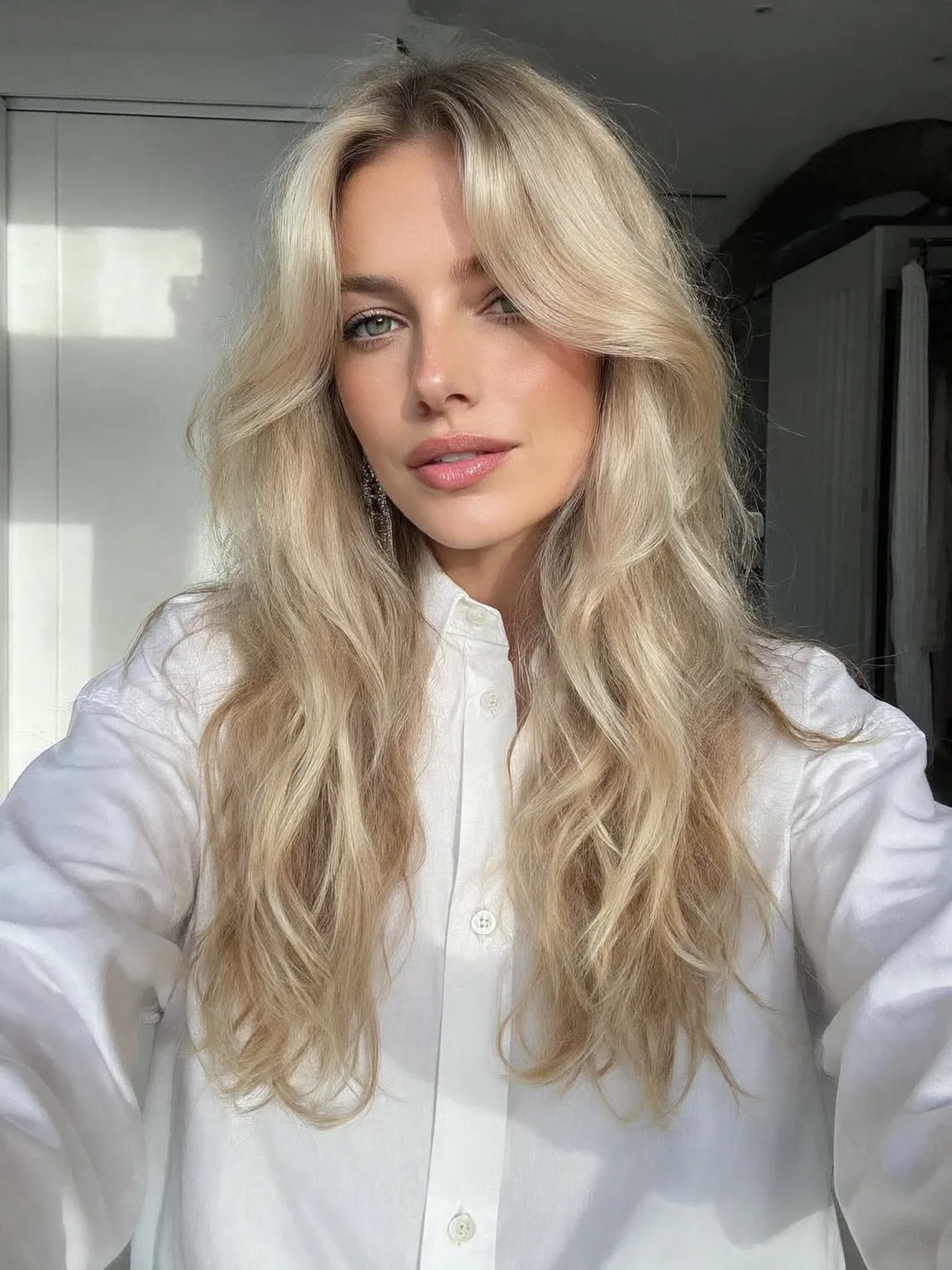 Vanilla Blonde Voluminous Waves with Curtain Bangs